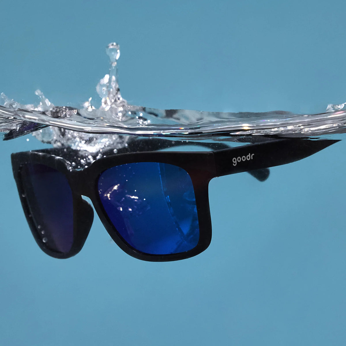 Black sunglasses with blue reflective lenses. Water repellent and capable of floating.