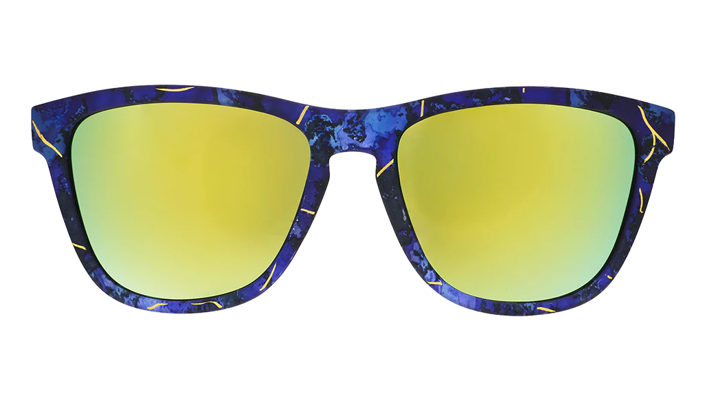 Multi-coloured square-shaped sunglasses with teal-coloured mirrored lenses. 