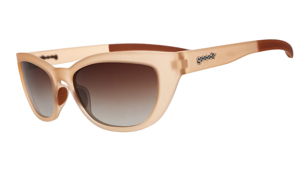 Translucent brown sunglasses in a cat-eye shape. Polarised brown gradient lenses with UV400 protection.