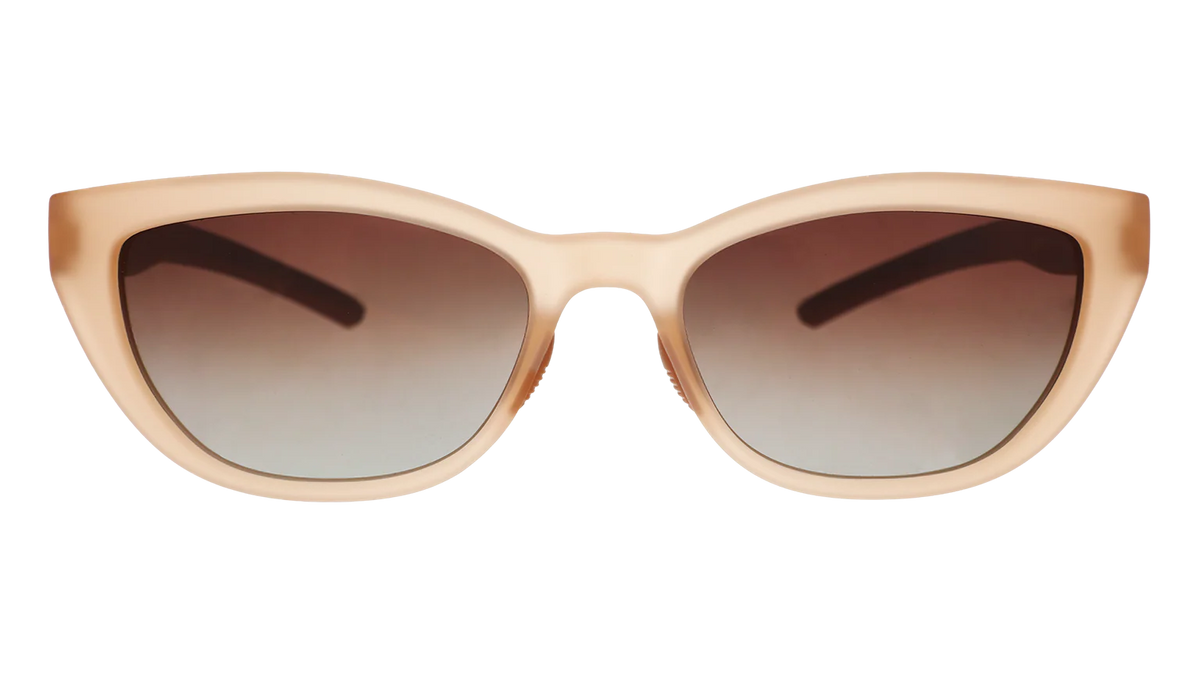 Translucent brown sunglasses in a cat-eye shape. Polarised brown gradient lenses with UV400 protection.