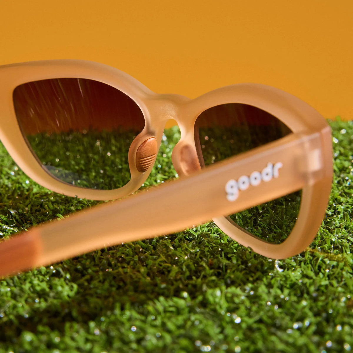 Translucent brown sunglasses in a cat-eye shape. Polarised brown gradient lenses with UV400 protection.